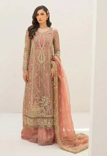 Woman wearing a peach and gold embroidered formal Pakistani dress by Qalamkar, featuring intricate detailing and a matching dupatta, ideal for weddings and special occasions.