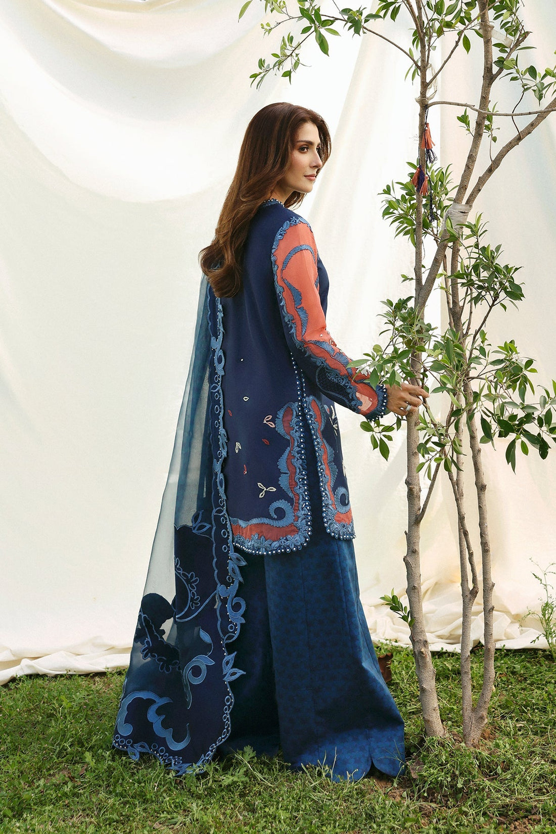 Model wearing Afrozeh Avaia navy shirt & trouser set