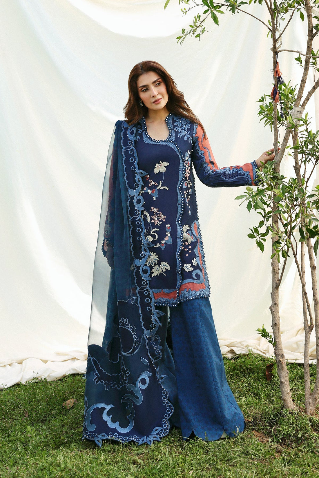Model wearing Afrozeh Avaia navy shirt & trouser set