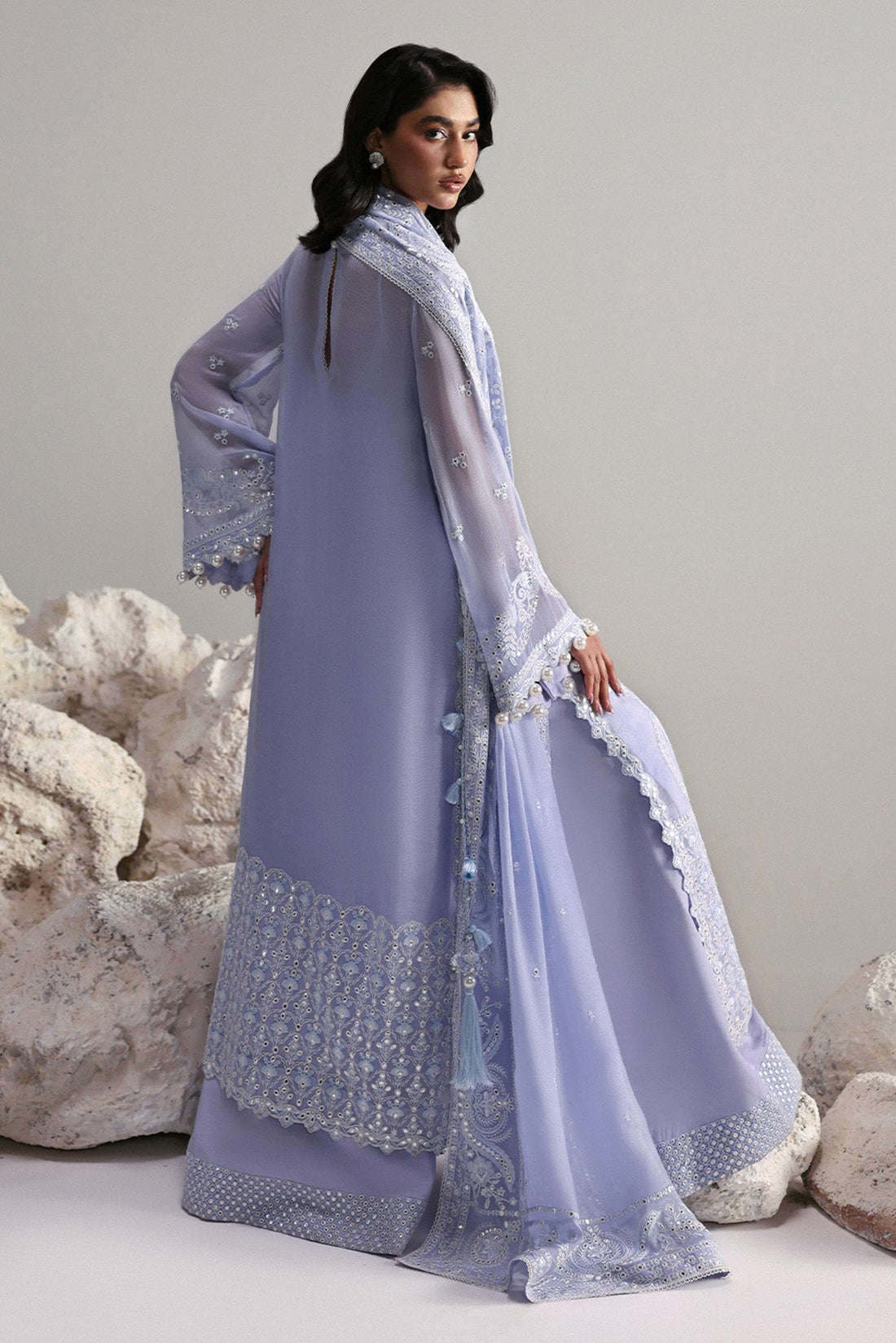 Model wearing Afrozeh Vaelis white long shirt & sharara