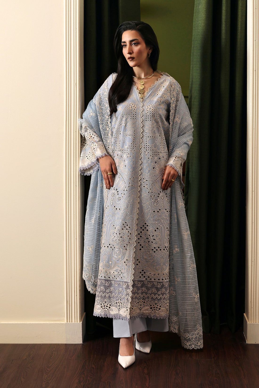 Model wearing Afrozeh Crimsal blue embroidered lawn suit