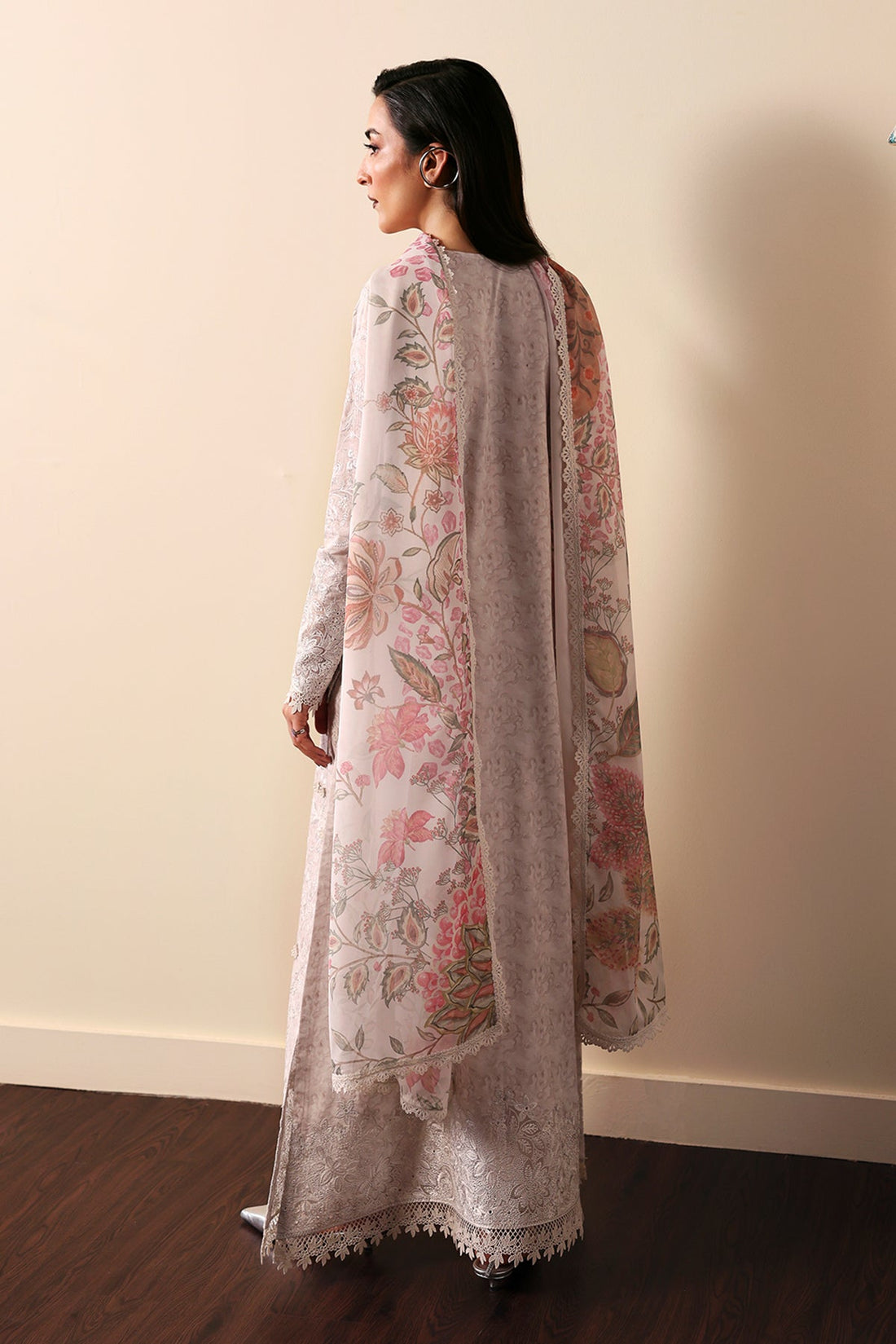 Model wearing Afrozeh Leyla embroidered lawn suit
