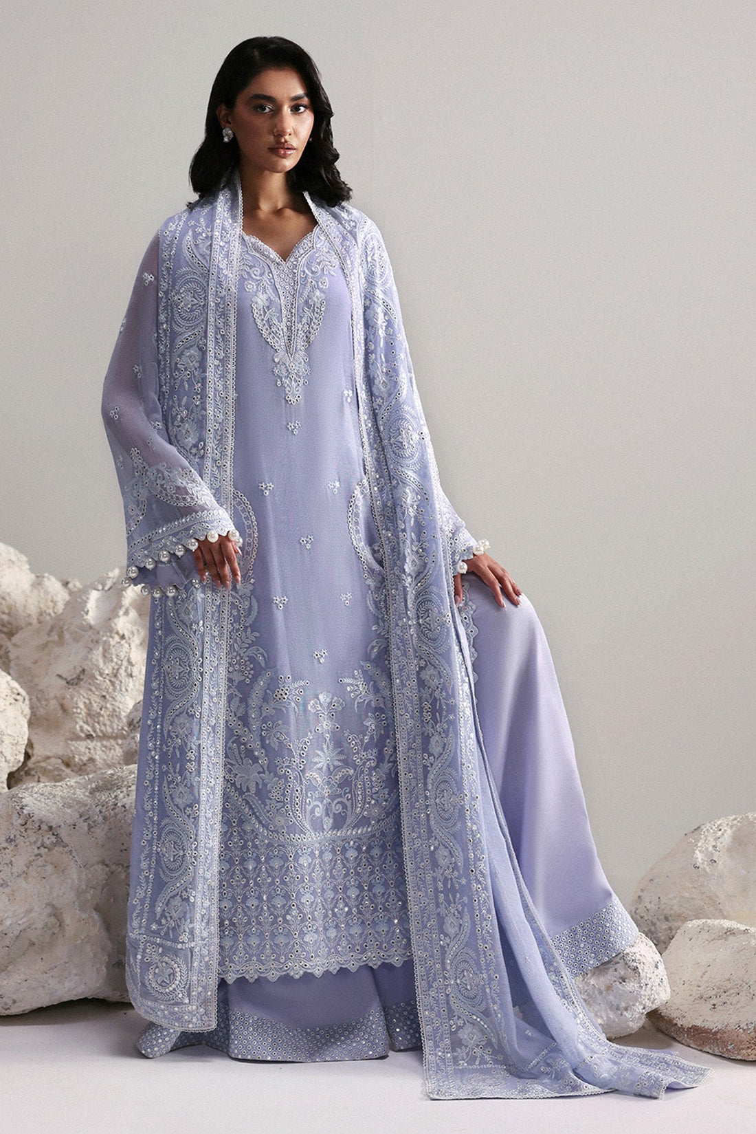 Model wearing Afrozeh Vaelis white long shirt & sharara