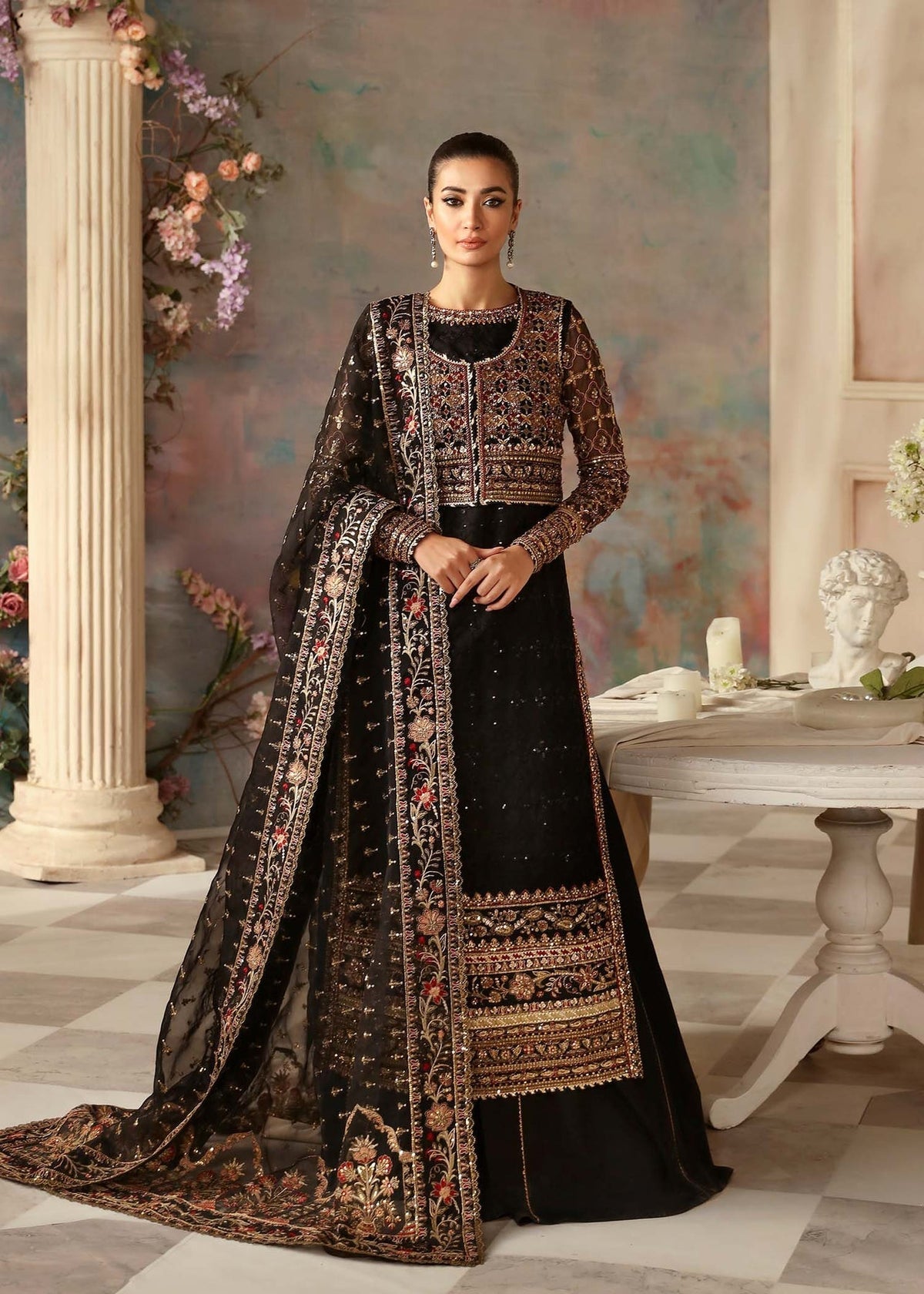 Model wearing Akbar Aslam Ebene black shirt & trousers with dupatta