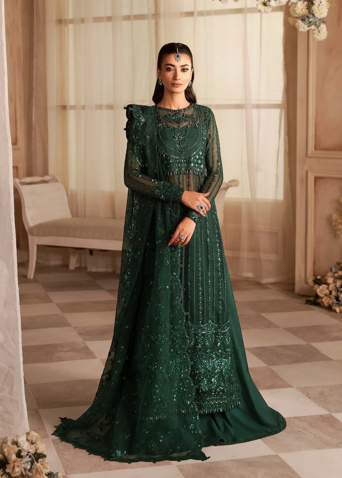 Model wearing Akbar Aslam Emeraude ivory shirt & trousers with dupatta