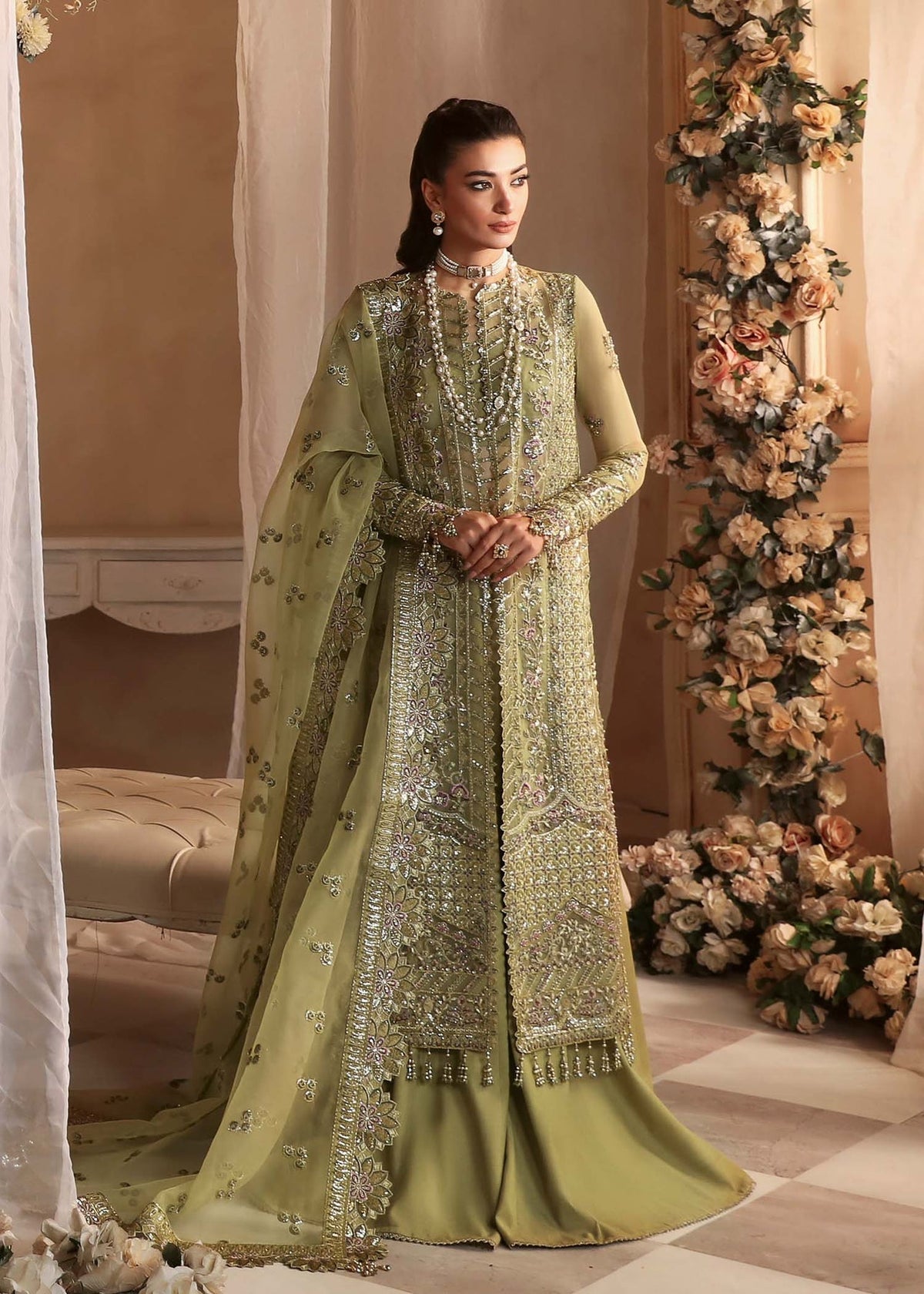Model wearing Akbar Aslam Seren drab shirt & trousers with dupatta
