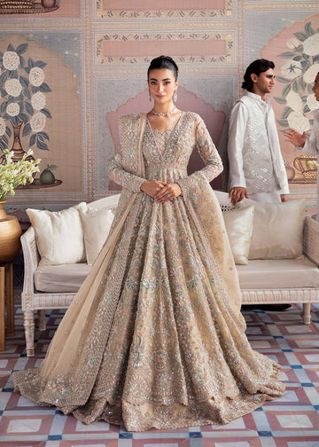 Model wearing Akbar Aslam MOONSTONE light peach panelled maxi with dupatta