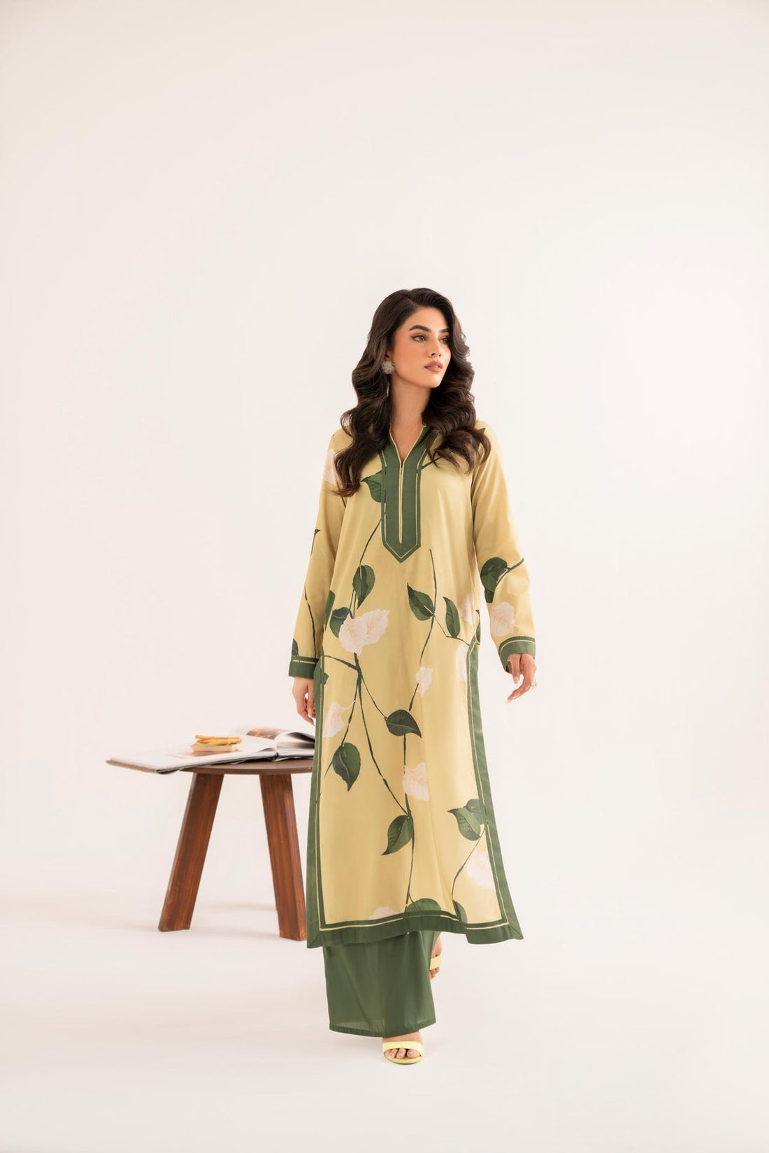 Model wearing Akbar Aslam Burwai long shirt & trousers co-ord
