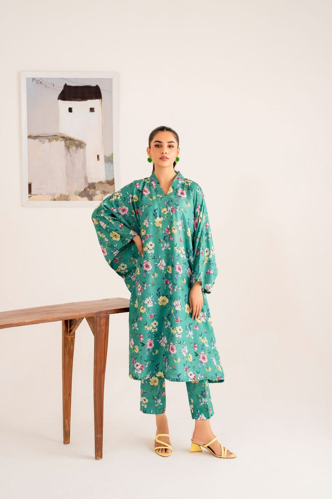 Model wearing Akbar Aslam Koa long shirt & trousers co-ord