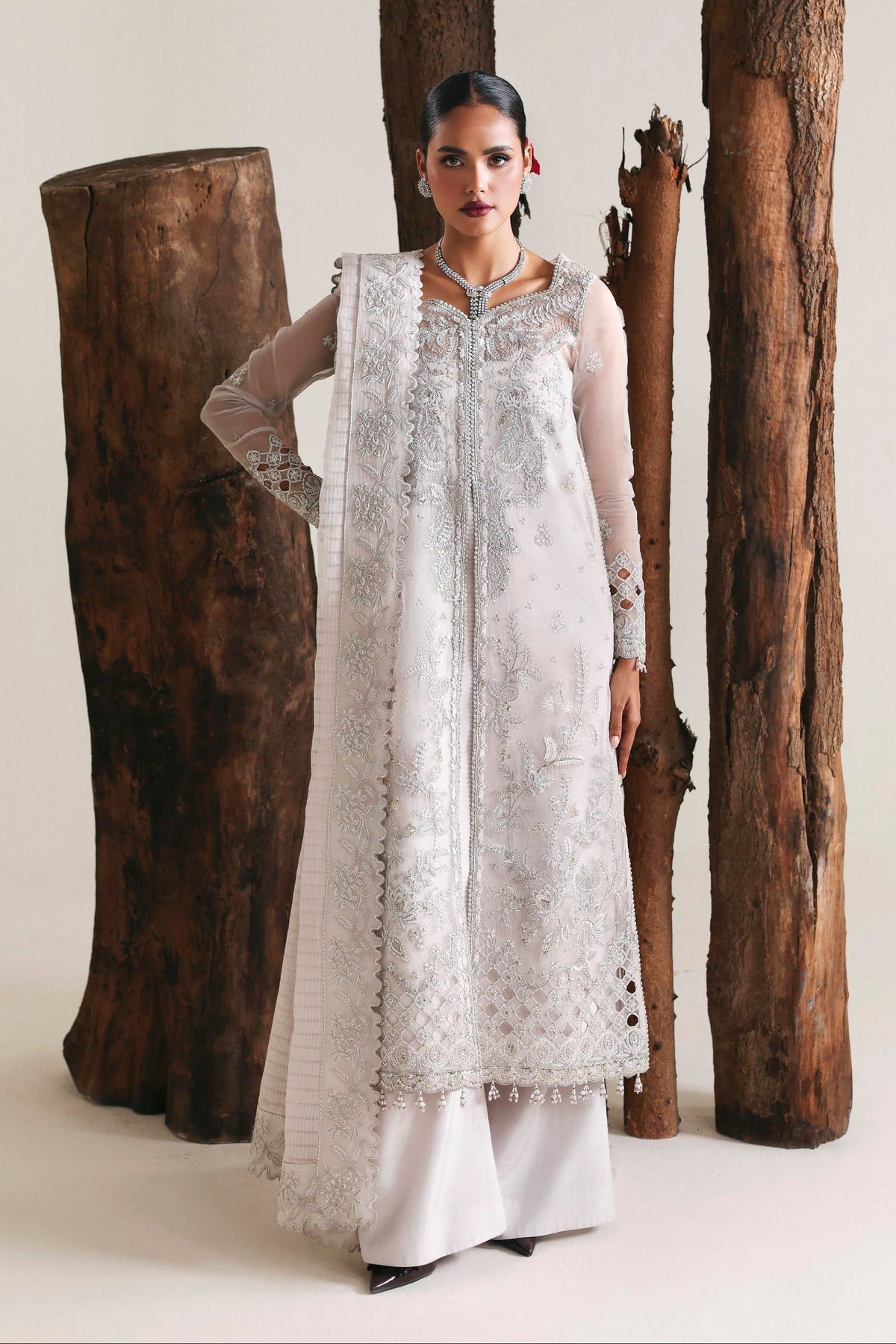 Model wearing Akbar Aslam Allure shirt & trousers with dupatta
