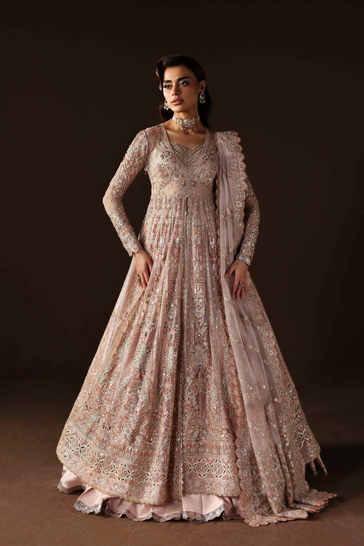 Model wearing Akbar Aslam Ember blouse & lehenga with dupatta