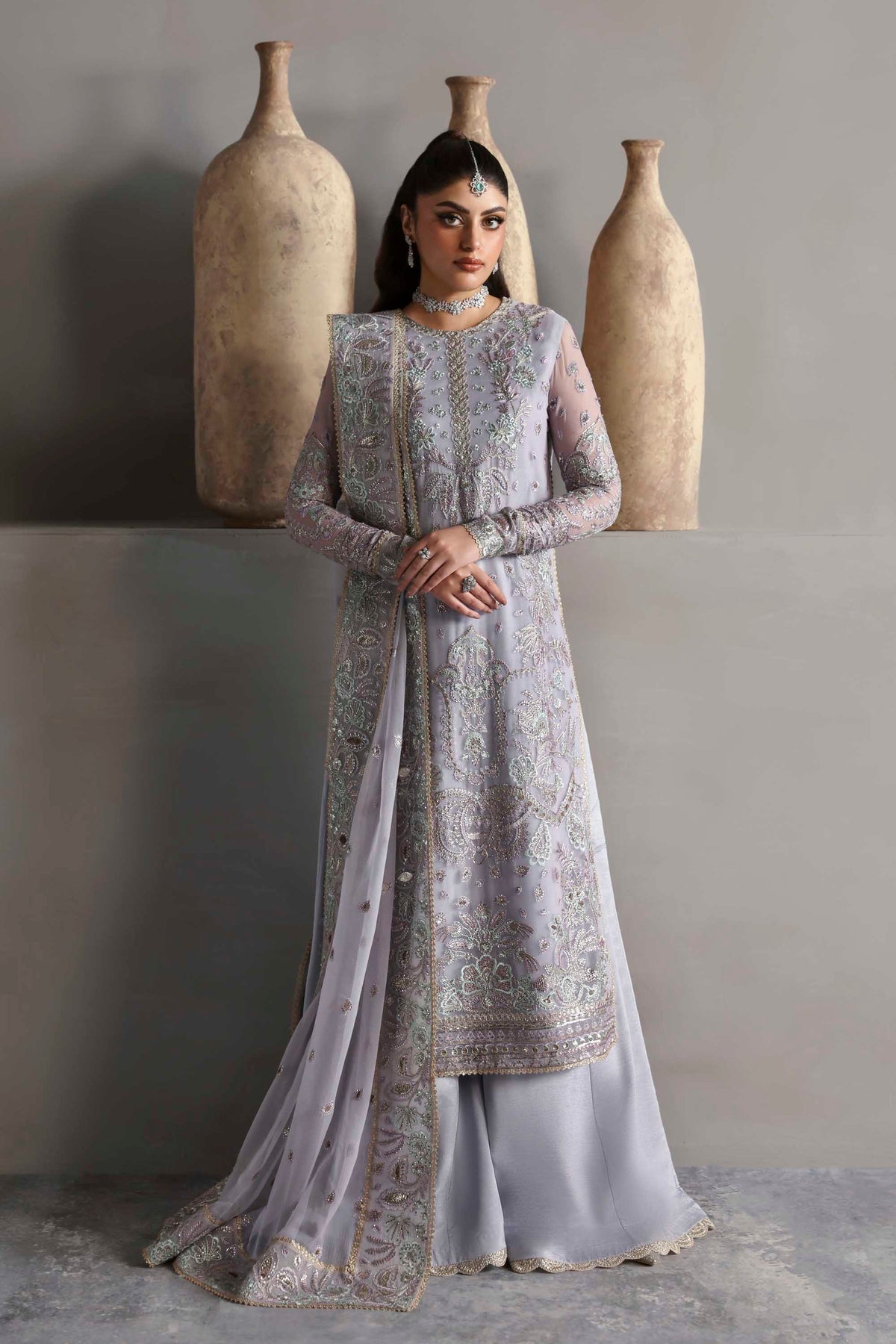 Model wearing Akbar Aslam Emeraya shirt & trousers with dupatta