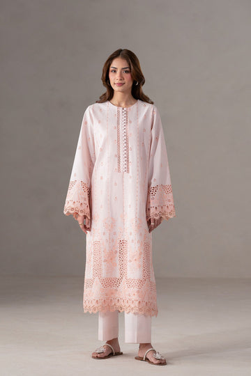 Model wearing Akbar Aslam Eloura long shirt & trousers