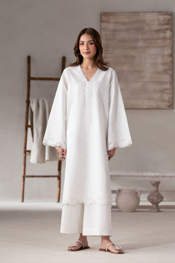 Model wearing Akbar Aslam Solace long shirt & trousers