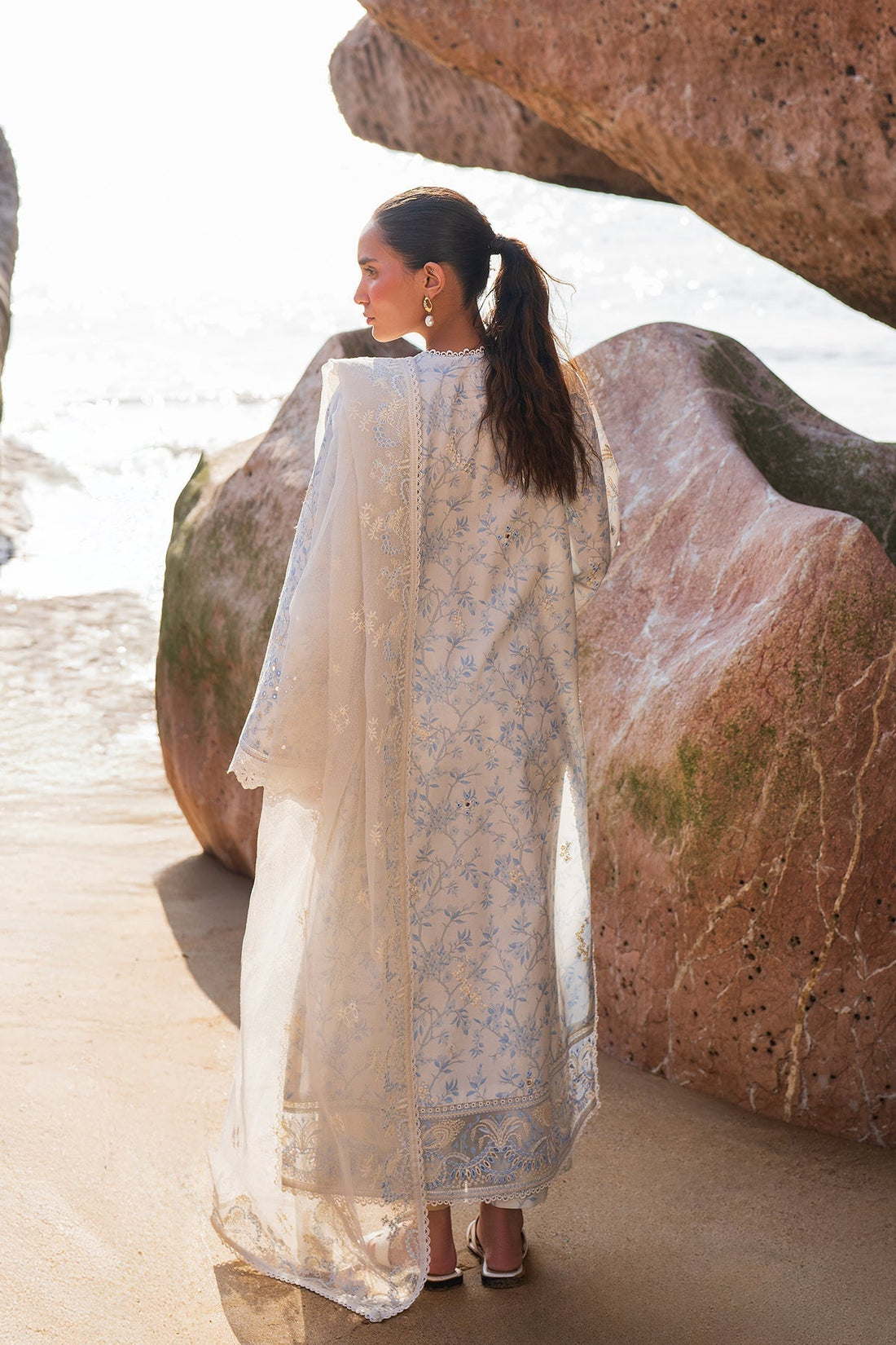 Model wearing Afrozeh Nerida white embroidered lawn suit