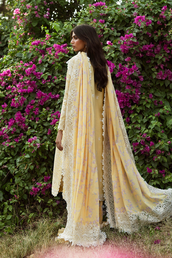 Model wearing Afrozeh Taqdeer yellow shirt & trouser set