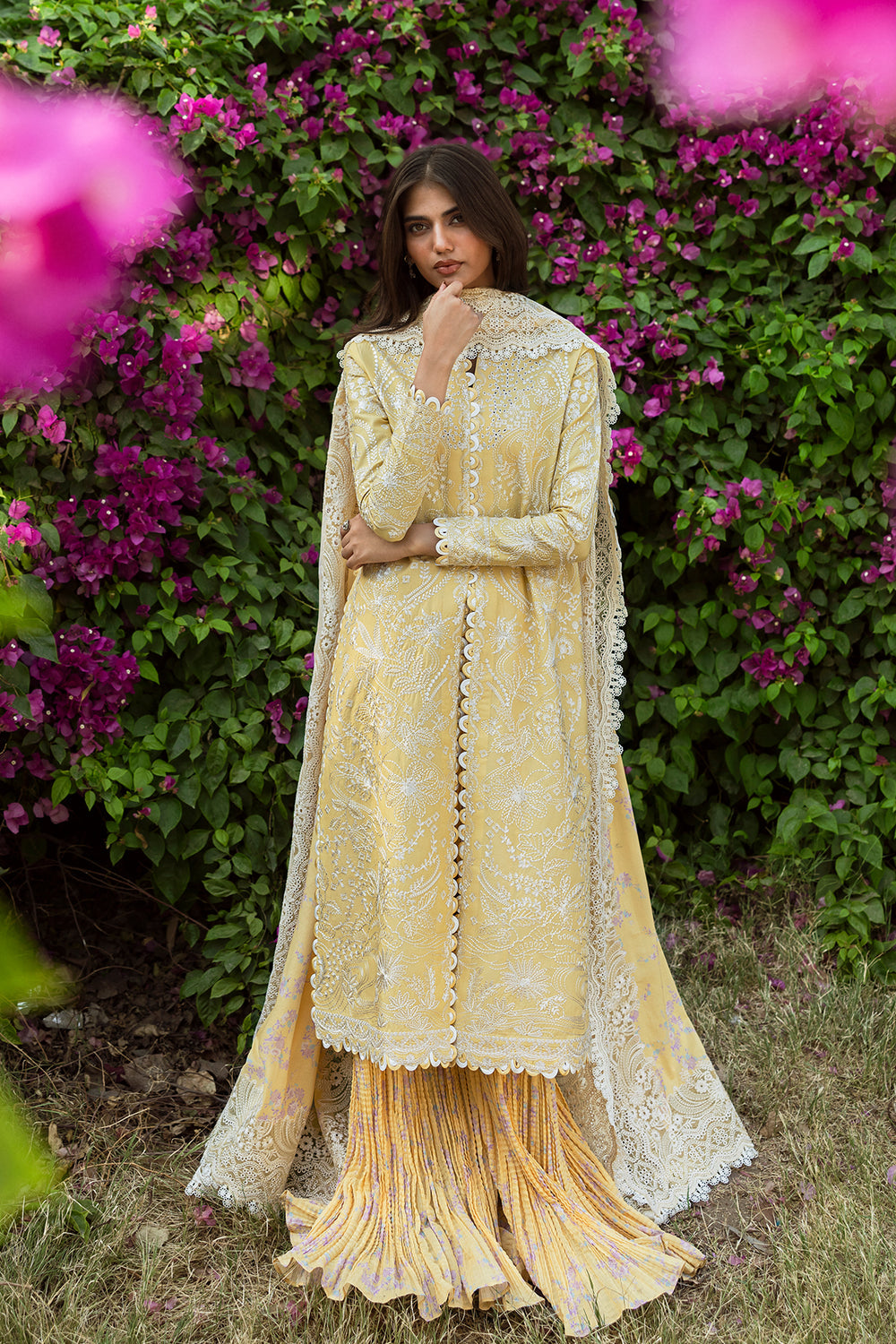 Model wearing Afrozeh Taqdeer yellow shirt & trouser set