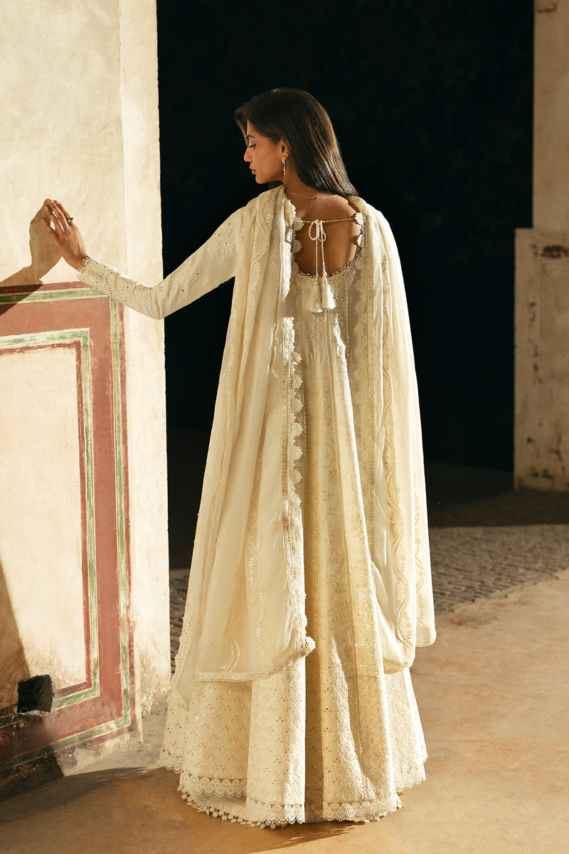 Model wearing Afrozeh Ishq ivory shirt & trouser set