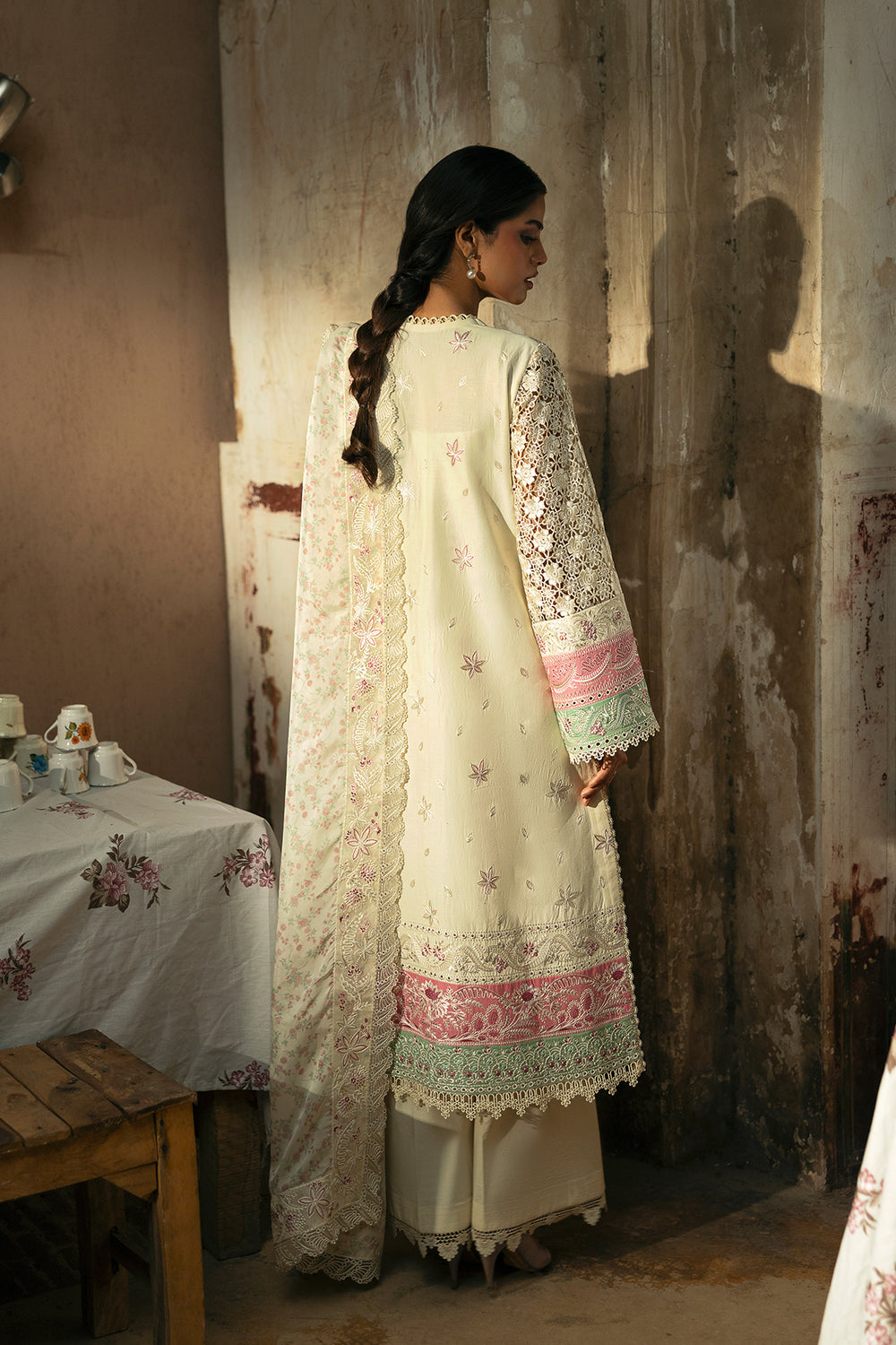 Model wearing Afrozeh Mohabbat ivory shirt & trouser set