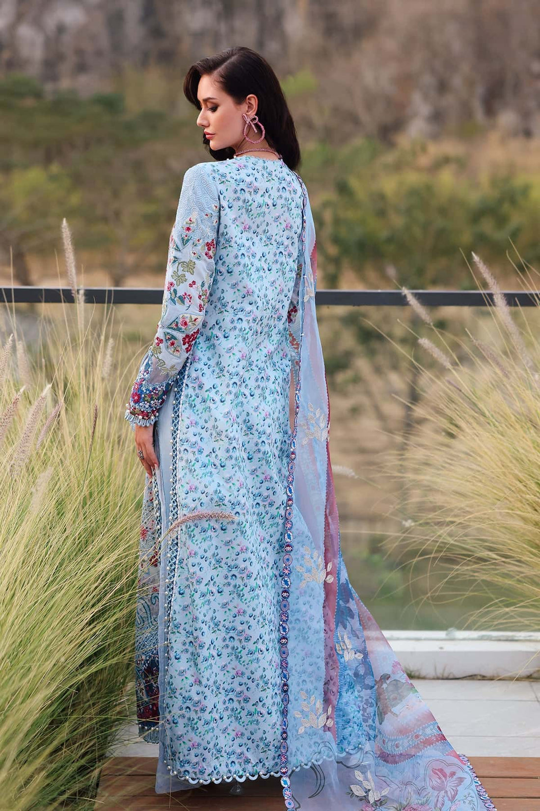 Model wearing Afrozeh Presta blue embroidered lawn suit