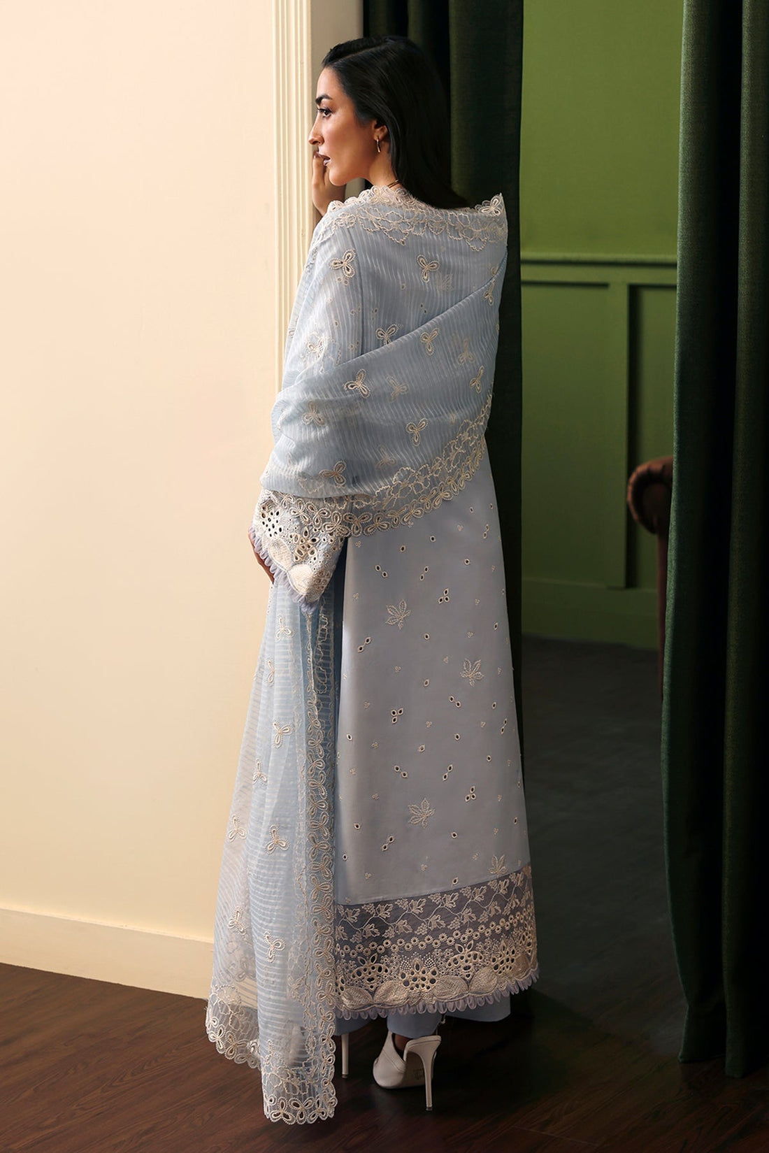 Model wearing Afrozeh Crimsal blue embroidered lawn suit