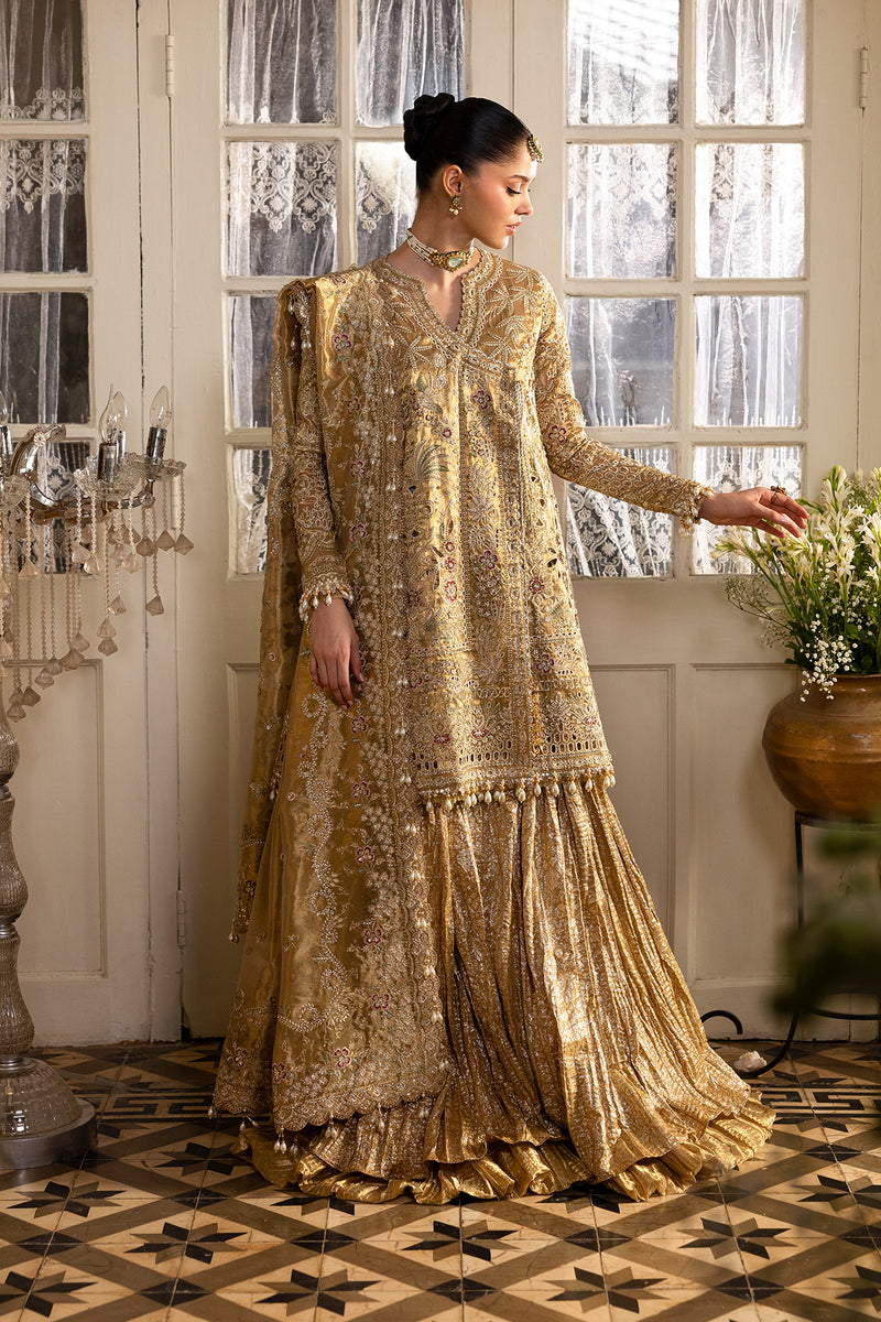Model wearing Afrozeh Goldveil gold short shirt & sharara