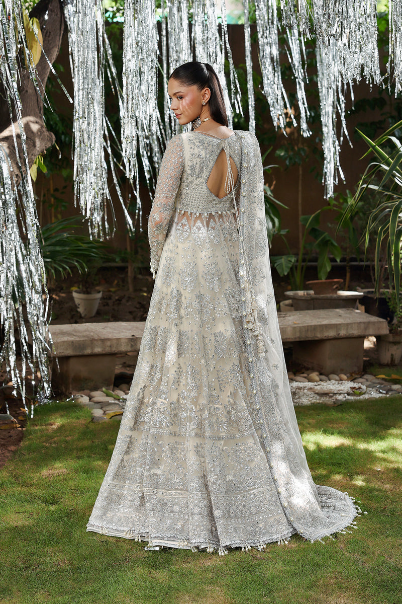 Model wearing Afrozeh Twilune white lehenga choli with dupatta