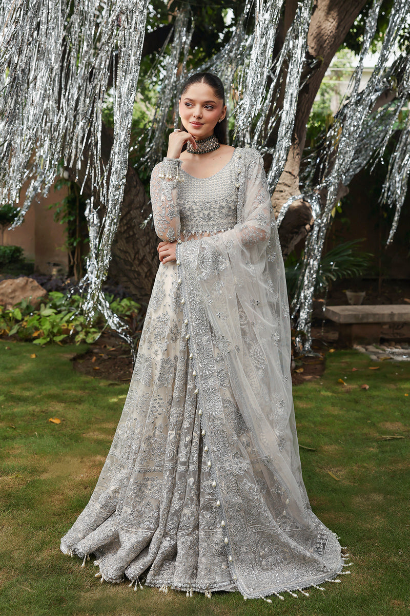 Model wearing Afrozeh Twilune white lehenga choli with dupatta