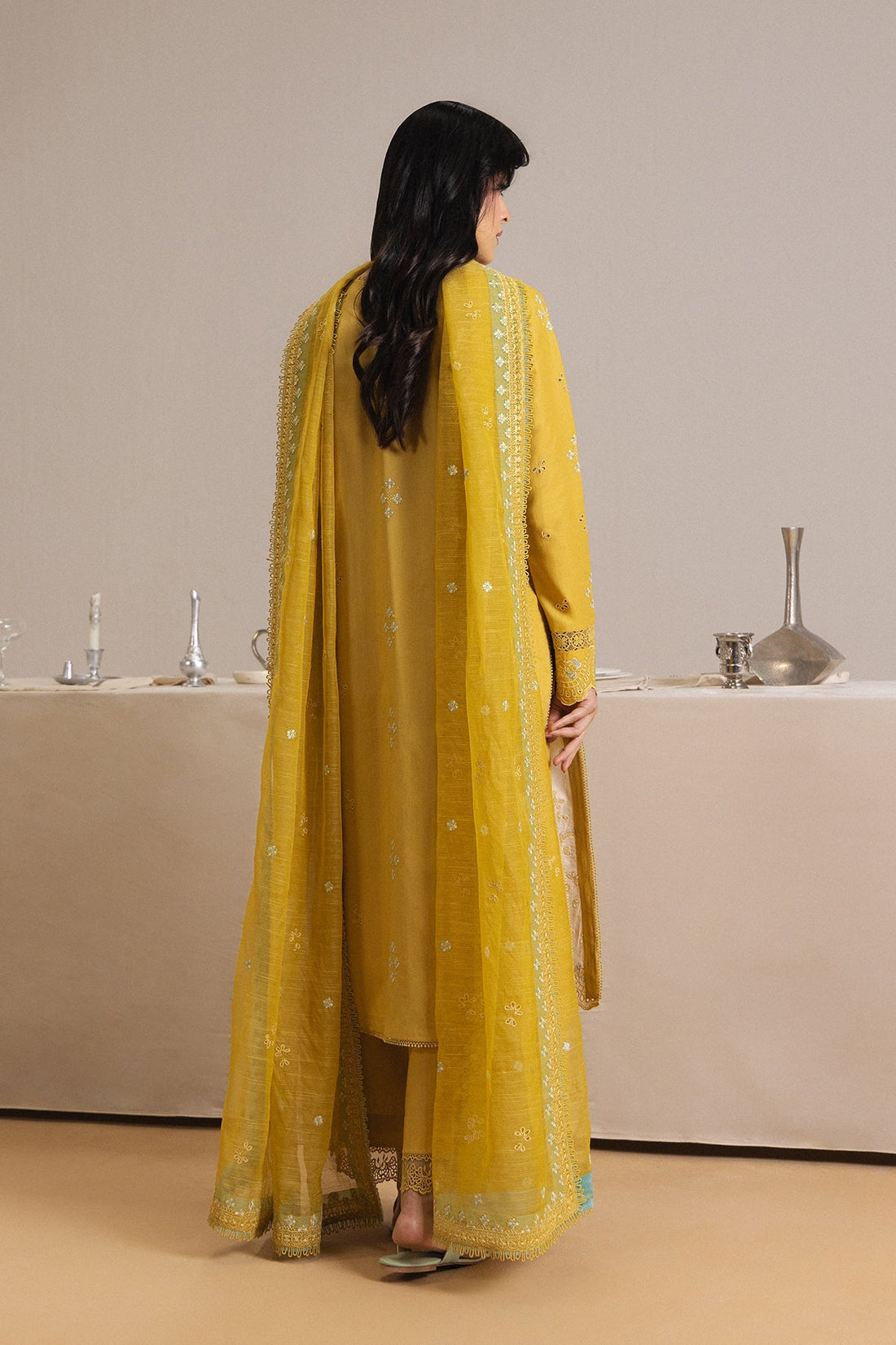 Model wearing Afrozeh Rouge yellow shirt & trouser set
