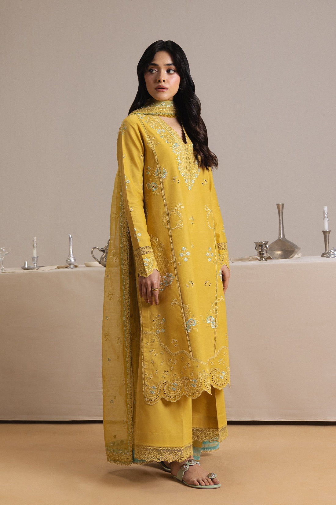 Model wearing Afrozeh Rouge yellow shirt & trouser set